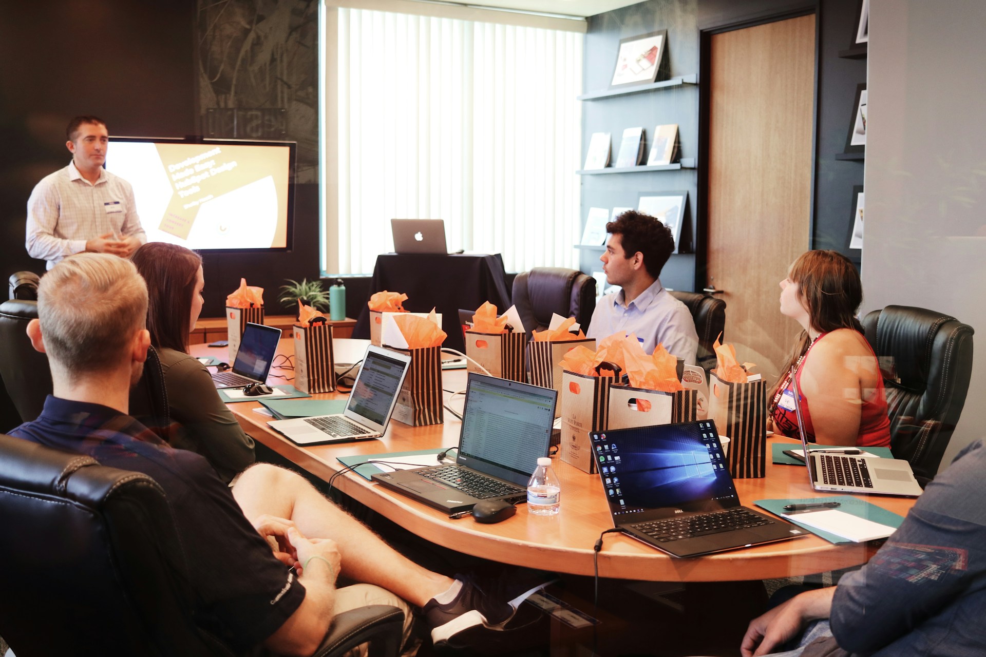 Team meeting in a board room brainstorming together